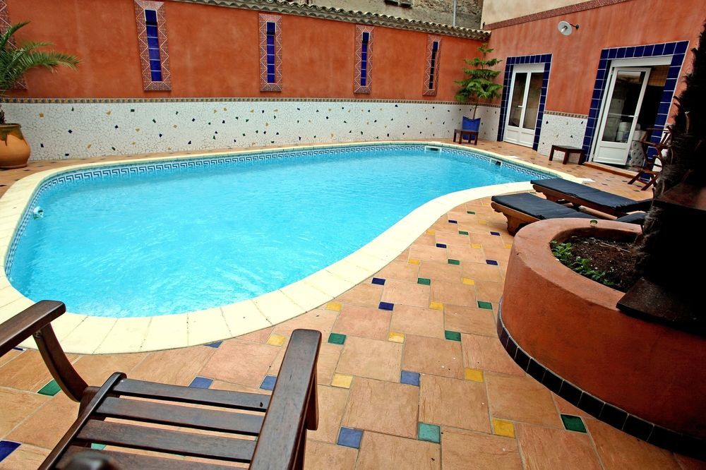 Logis Hotel Restaurant De La Paix Лодев Экстерьер фото